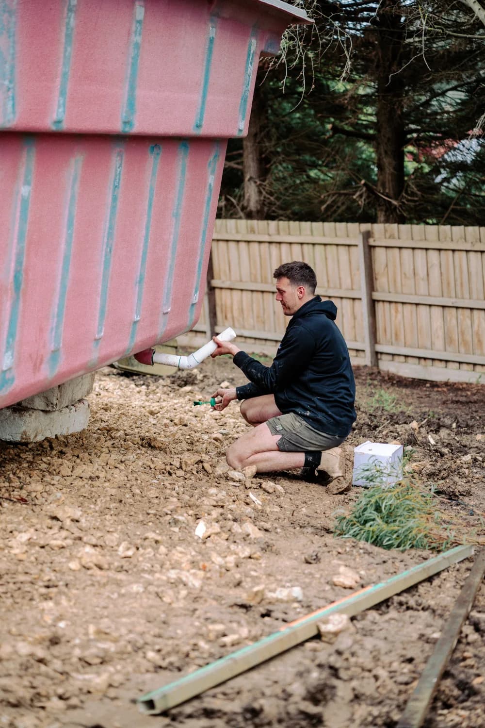 Enchanted Pools installer preparing a pool plumbing connection